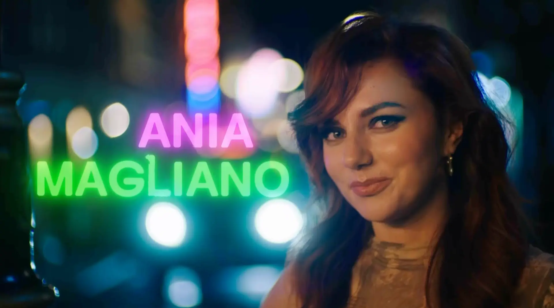 Ania Magliano in the SNL UK Series 2 opening titles, with pink and green neon name graphics
